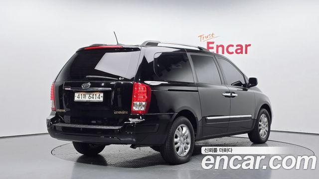 Kia Canival 2012 — photo 2