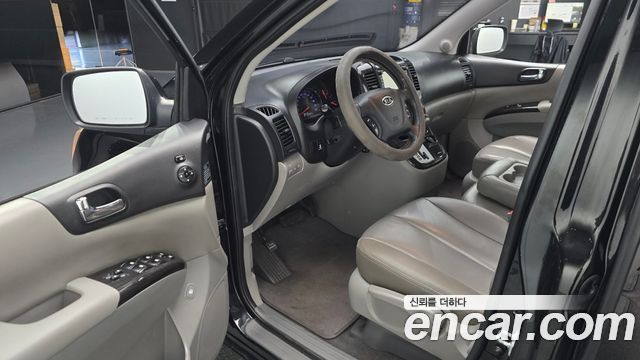 Kia Canival 2012 — photo 13