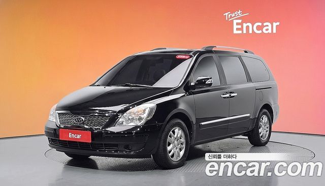 Kia Canival 2012 — photo 1