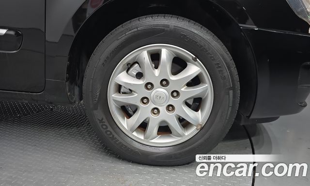 Kia Canival 2012 — photo 7