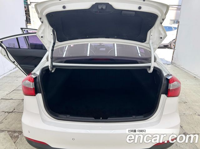 Kia K3 2013 — photo 16