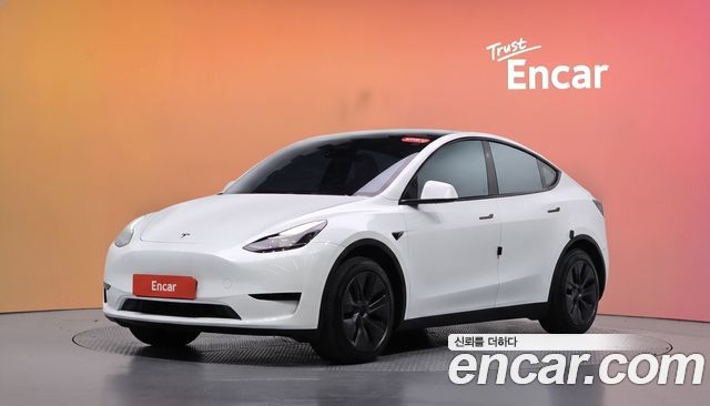 Tesla Model Y 2024 — photo 1
