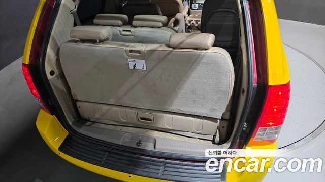 Kia Canival 2012 — photo 33