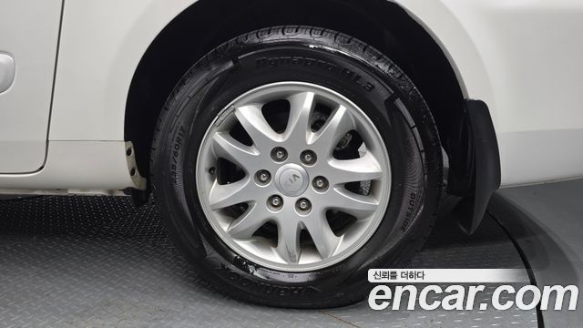 Kia Canival 2012 — photo 7
