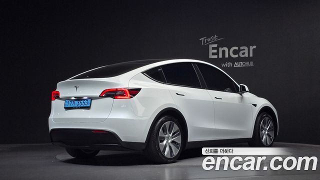 Tesla Model Y 2024 — photo 2