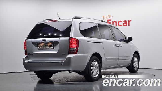 Kia Canival 2012 — photo 2
