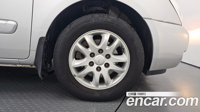 Kia Canival 2012 — photo 7