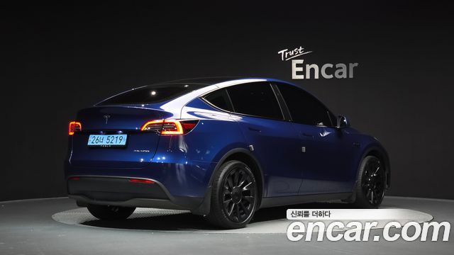 Tesla Model Y 2024 — photo 2