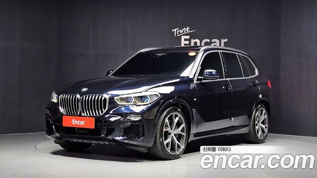 BMW X5 2021 — photo 1