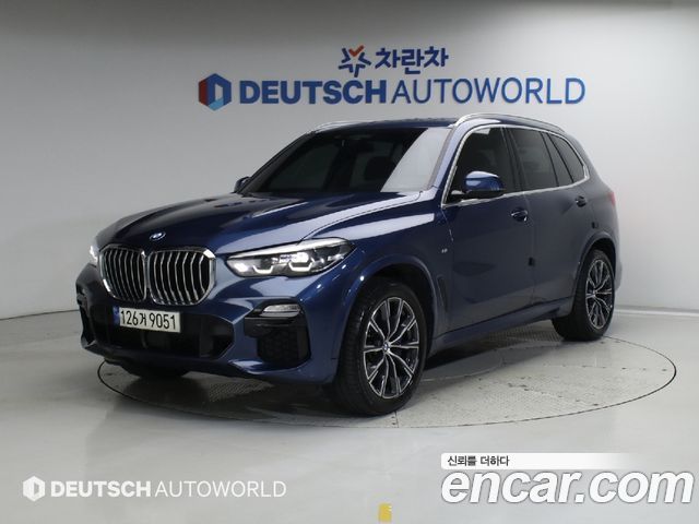 BMW X5 2021 — photo 1