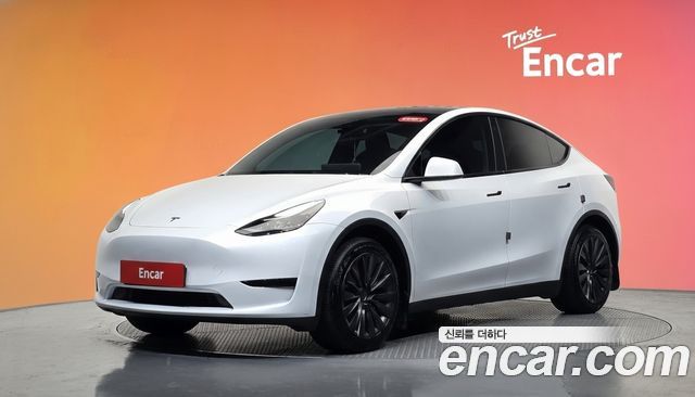 Tesla Model Y 2024 — photo 1