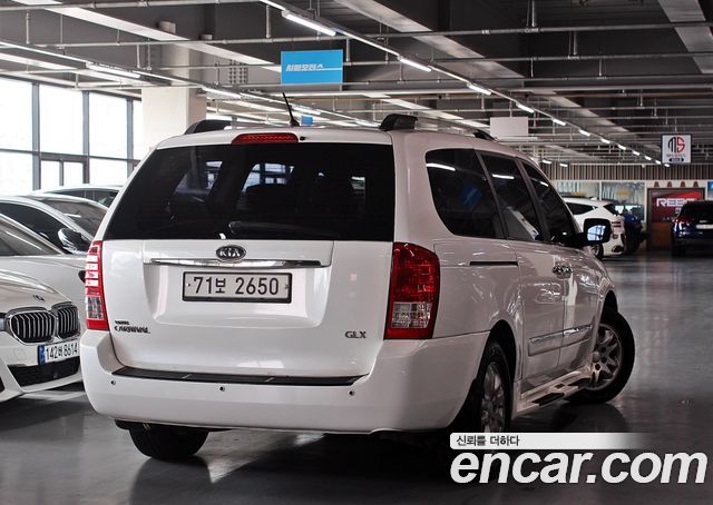 Kia Canival 2012 — photo 2