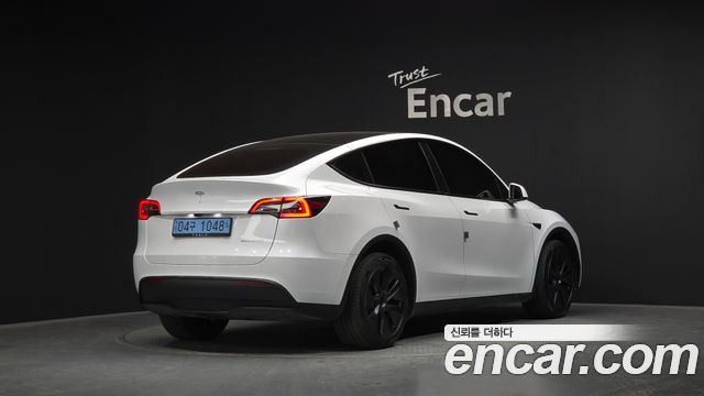 Tesla Model Y 2024 — photo 2