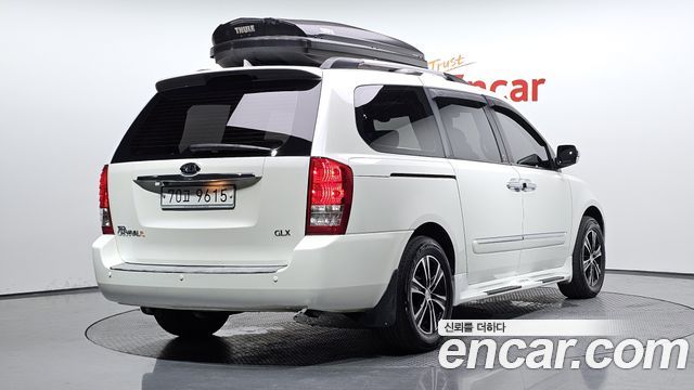 Kia Canival 2011 — photo 2