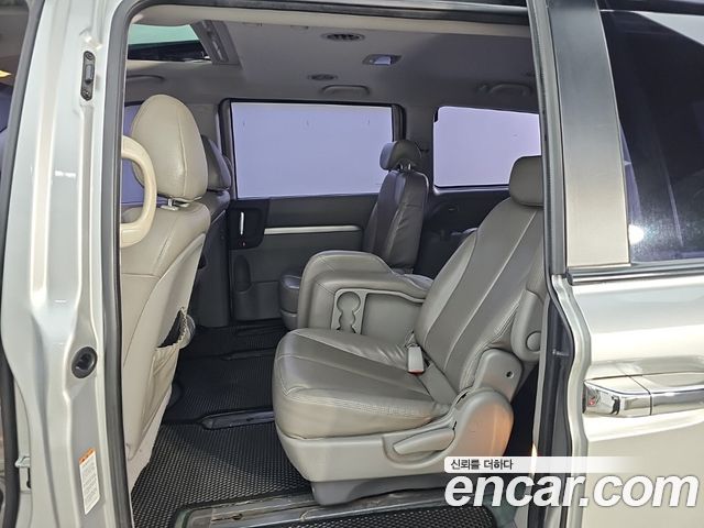 Kia Canival 2013 — photo 12
