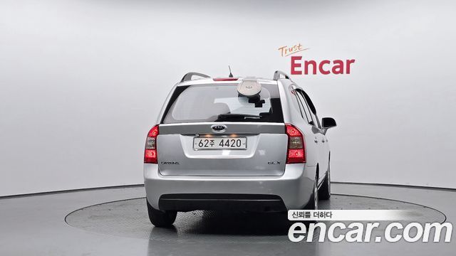 Kia Carens 2009 — photo 4