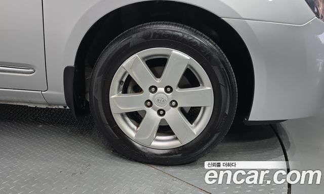 Kia Carens 2009 — photo 7