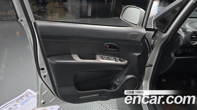 Kia Carens 2009 — photo 14