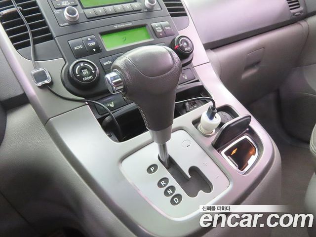 Kia Canival 2013 — photo 12