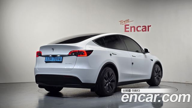 Tesla Model Y 2024 — photo 2