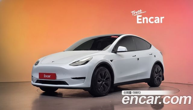 Tesla Model Y 2024 — photo 1