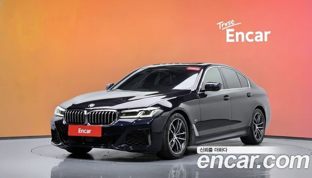 BMW 5-Series 2023 — photo 1