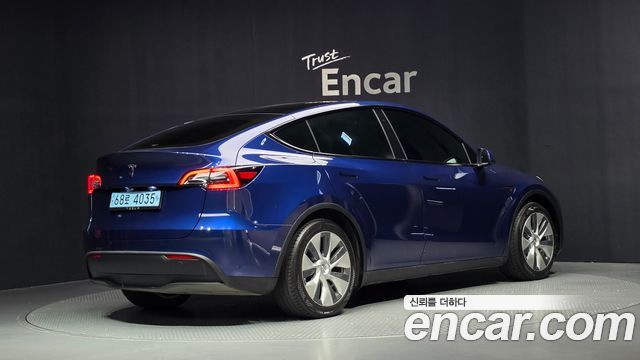 Tesla Model Y 2024 — photo 2