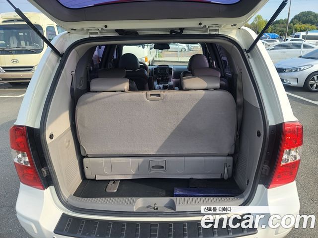 Kia Canival 2012 — photo 13