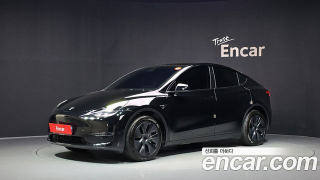 Tesla Model Y 2024 — photo 1