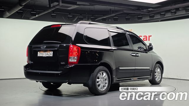 Kia Canival 2012 — photo 2