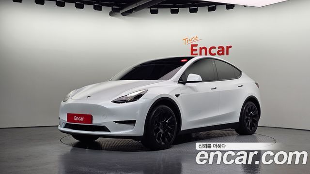 Tesla Model Y 2024 — photo 1