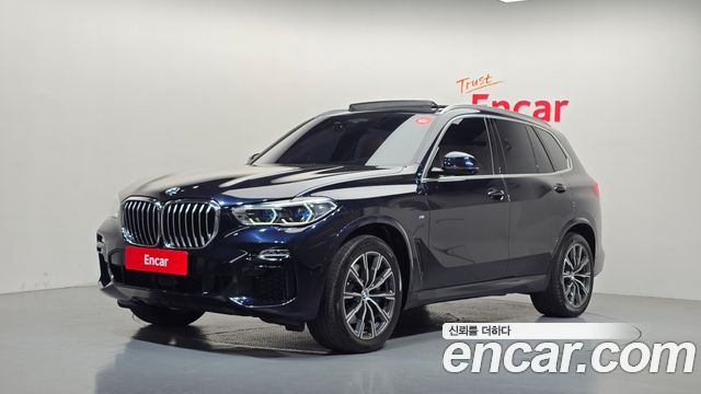 BMW X5 2021 — photo 1