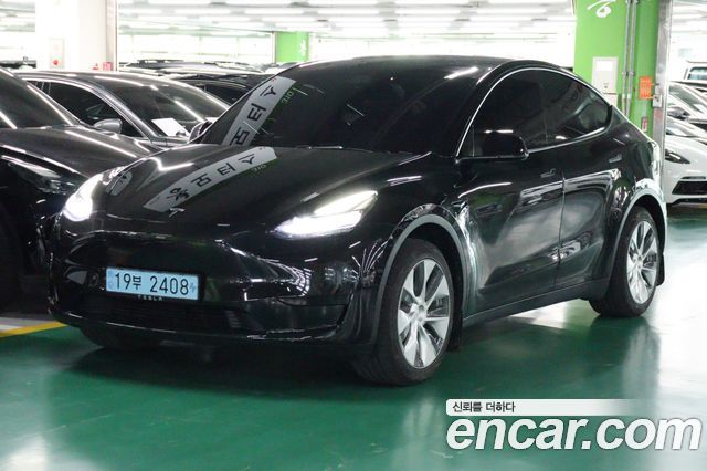 Tesla Model Y 2024 — photo 2