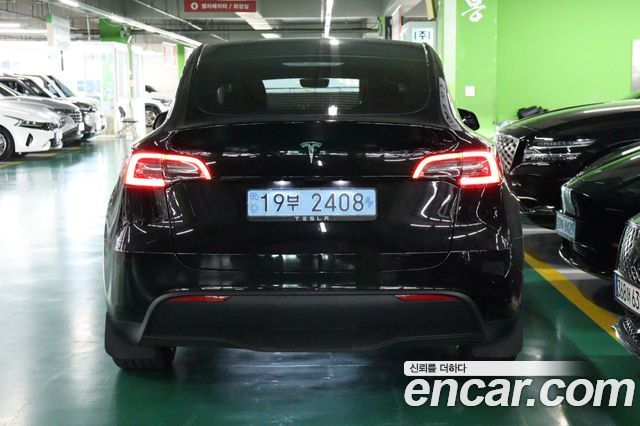 Tesla Model Y 2024 — photo 4