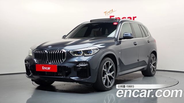 BMW X5 2021 — photo 1
