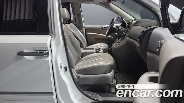 Kia Canival 2013 — photo 17