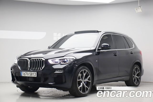 BMW X5 2021 — photo 1