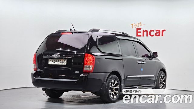 Kia Canival 2011 — photo 2