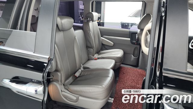 Kia Canival 2013 — photo 17