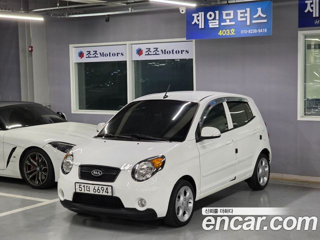 Kia morning 2011 — photo 1