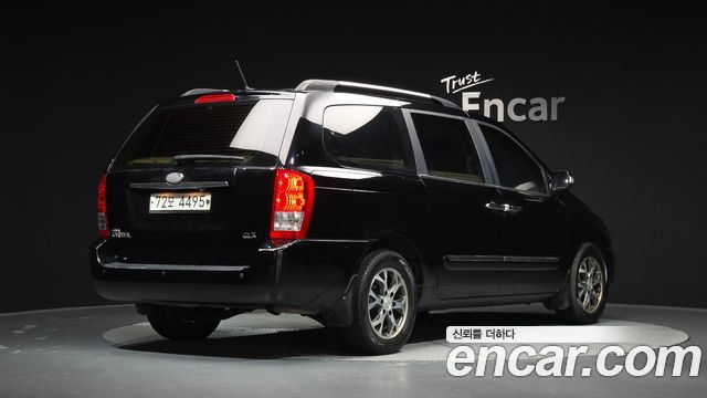 Kia Canival 2013 — photo 2