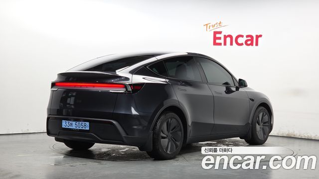 Tesla Model Y 2025 — photo 2