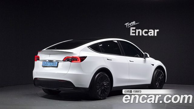 Tesla Model Y 2024 — photo 2