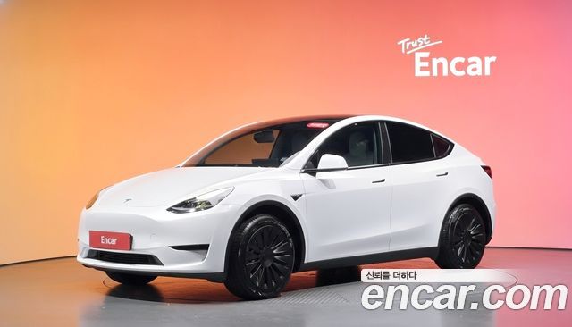 Tesla Model Y 2024 — photo 1