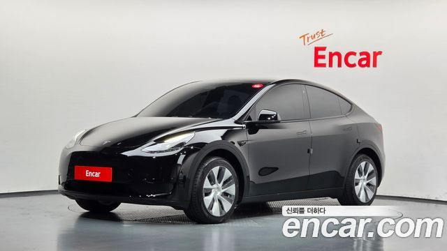 Tesla Model Y 2024 — photo 1