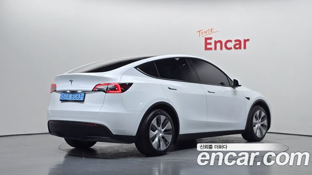 Tesla Model Y 2024 — photo 2