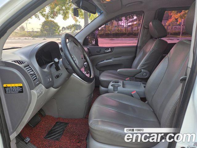 Kia Canival 2013 — photo 11