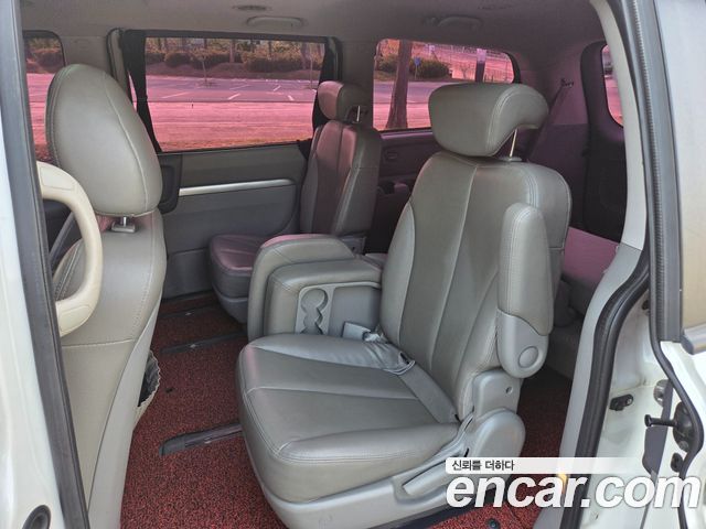 Kia Canival 2013 — photo 12