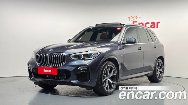 BMW X5 2021 — photo 1