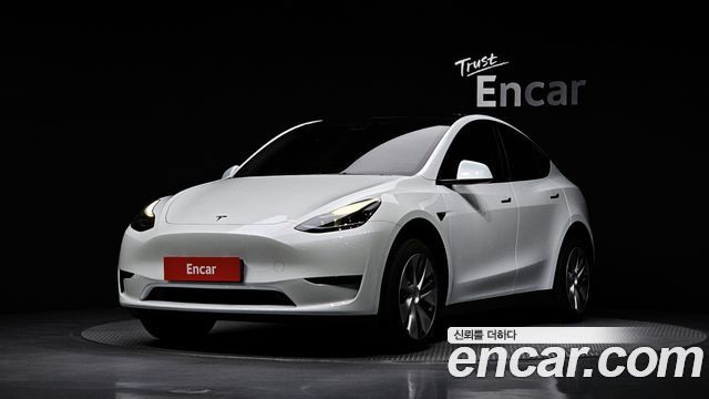 Tesla Model Y 2024 — photo 1